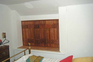 02-made-to-measure-trifold-front-bedroom-shutters-sapele-wood