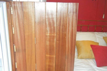 06-made-to-measure-trifold-front-bedroom-shutters-sapele-wood
