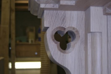 009-large-oak-fireplace-in-workshop-close-up-of-left-hand-corbel-with-decorative-quatrefoil