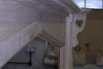 010-large-oak-fireplace-in-workshop-close-up-of-headpiece