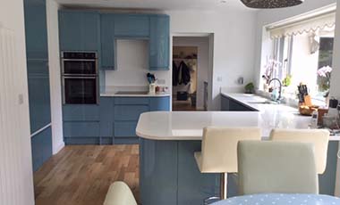 Fitted Wren Kitchen blue cupboards
